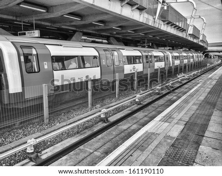 LONDON - SEP 30: Long subway train in a city station, September 30, 2013 in London. London Underground is the 11th busiest metro system worldwide with 1.1 billion annual rides