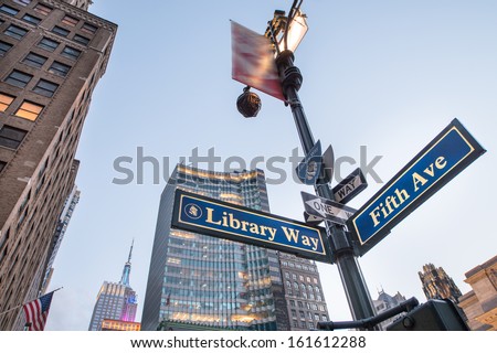 Library Way street sign with skyscrapers at sunset New York City Library Way street sign with skyscrapers at sunset New York City