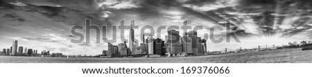 Panoramic view of Jersey City in black and white, Lower Manhattan and Brooklyn Bridge from Governors Island - New York.