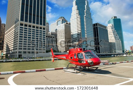 Red Helicopter ready to fly over Manhattan on a beautiful summer day - New York City.
