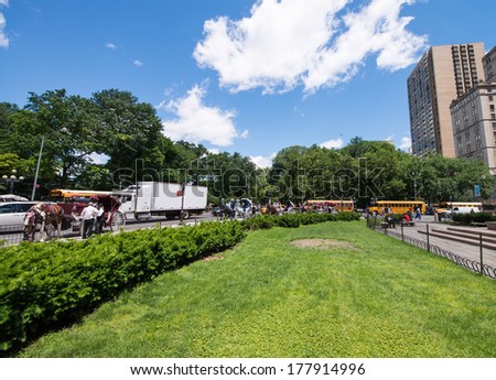 NEW YORK CITY - CIRCA JUNE 2013: People relax in Central Park area. Central Park is an urban park in the eastern portion of the central-upper West Side of Manhattan.