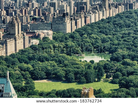 Beautiful aerial view of Central park with skyscrapers on a sunny day - New York City.