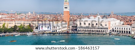 VENICE - APRIL 7, 2014: Aerial view of Saint Mark Square with tourists in the streets. 21 million people visit the city every year.