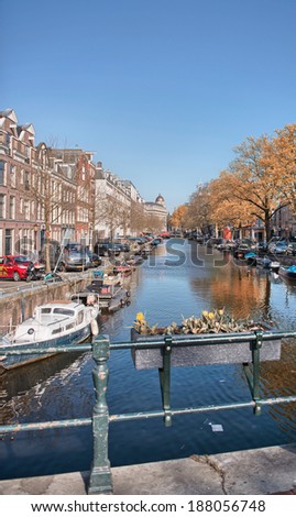 AMSTERDAM - APRIL 30, 2013: City streets on Queen\'s day. More than 7 million tourists visit the city every year