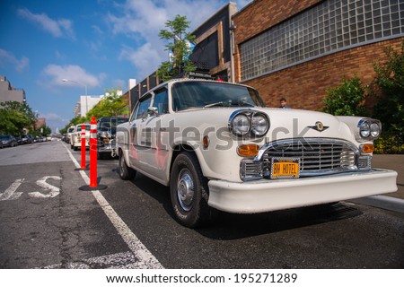 BROOKLYN - JUN 11, 2013: Vintage white taxi cabs await customers. Today, more than 13,000 modern taxis take the place of the old ones