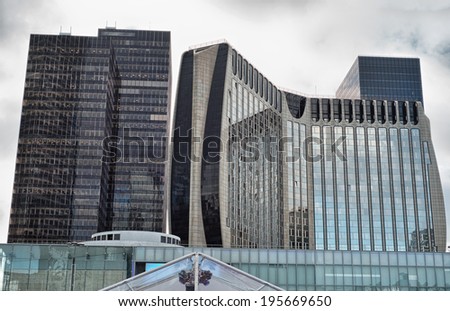 PARIS - DECEMBER 4, 2012: Buildings of La Defense on a cloudy day. La Defense is the main financial district of Paris.
