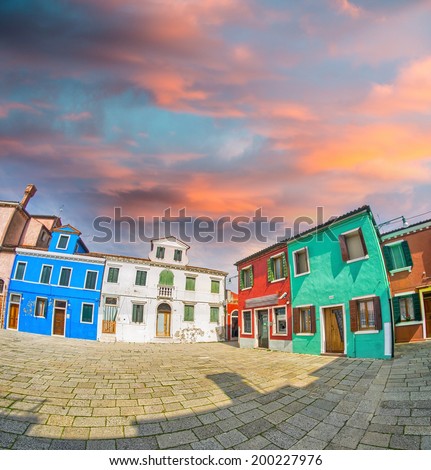 Colourful homes - Blue, white, red, green buildings at sunset