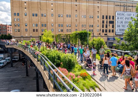 NEW YORK - JUNE 15, 2013: The High Line Park in New York with locals and tourists. The High Line is a popular linear park built on the elevated train tracks above Tenth Ave in New York City