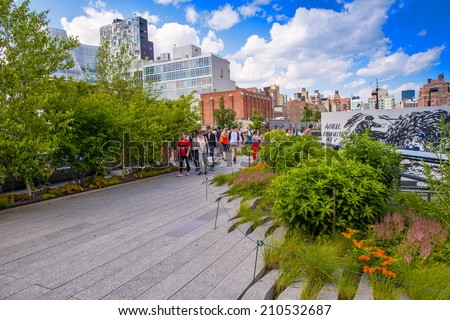 NEW YORK - JUNE 15, 2013: The High Line Park in New York with locals and tourists. The High Line is a popular linear park built on the elevated train tracks above Tenth Ave in New York City