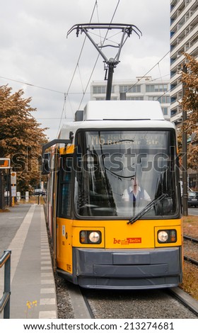 BERLIN - MAY 23, 2012: Yellow tram on city streets. The tram in Berlin is one of the oldest tram systems in the world
