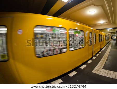 BERLIN - MAY 24, 2012: U-bahn train speeds up in subway station. The U-Bahn serves 170 stations spread across ten lines.