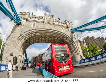 LONDON - SEP 30, 2012: Double Decker bus speeds up on Tower Bridge. An icon of the city,these modern buses came to replace an old classic,the AEC Routemaster that saw continous use from 1958 to 2005.