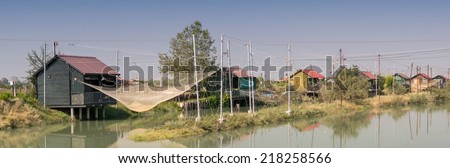 Fishing huts in Italy. People fish, cook and eat here.