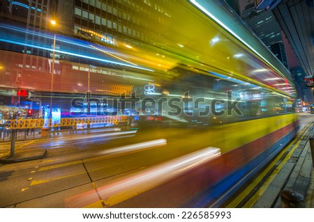 HONG KONG - MAY 10, 2014: Traffic light trails in the night. Public transportation is used by more tha 90 percent of population.