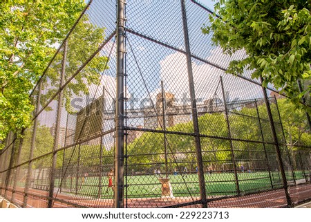 NEW YORK - JUNE 15, 2013: Chelsea Park sport field in Manhattan. The park has track, soccer field that doubles as a football and softball and kickball field.