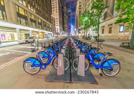 NEW YORK CITY - JUNE 8, 2013: NYC bike share system along city streets at night, Manhattan, New York City, USA