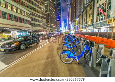 NEW YORK CITY - JUNE 8, 2013: NYC bike share system along city streets at night, Manhattan, New York City, USA