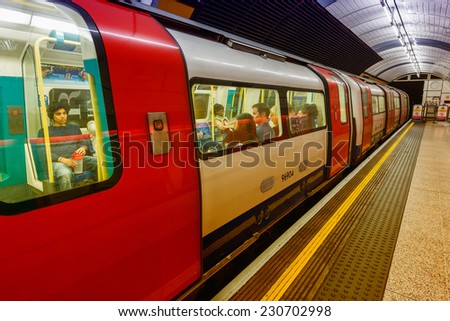 LONDON - SEPTEMBER 28, 2013: Subway train in underground station. London subway system serves 270 stations and has 402 kilometres (250 mi) of track.