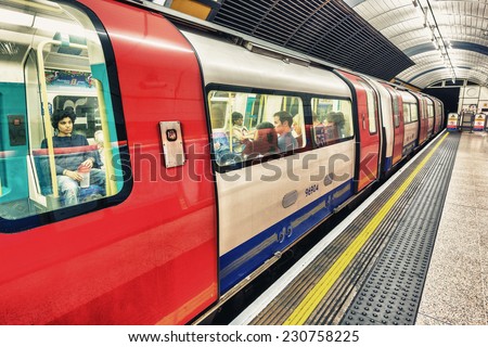 LONDON - SEPTEMBER 28, 2013: Subway train in underground station. London subway system serves 270 stations and has 402 kilometres (250 mi) of track.