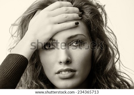 Closeup portrait of young woman, unhappy student, female worker, hand on forehead very upset sad disappointed depressed lost isolated on yellow background.Human emotions, facial expressions, reaction.