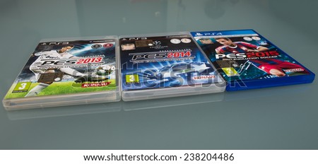 PISA, ITALY - DECEMBER 7, 2014: Pro evolution soccer game version 2013, 2014, 2015 by Konami. The videogame is a best seller and rivals Electronic Arts Fifa game.