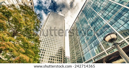 Canary Wharf skyline, office buildings, street view - London.