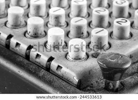 Black mechanical (vintage) calculator, isolated on white. (About 1950s - early 1970s from Germany).