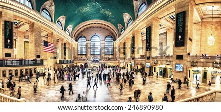 NEW YORK, JUNE 14: Commuters and tourists in the grand central station in June 14, 2013 in New York, panoramic view. It is the largest train station in the world by number of platforms: 44
