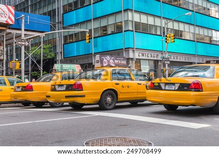 NEW YORK CITY - JUNE 11, 2013: Yellow cabs speed up in Manhattan. More than 13,000 taxis run in New York City.