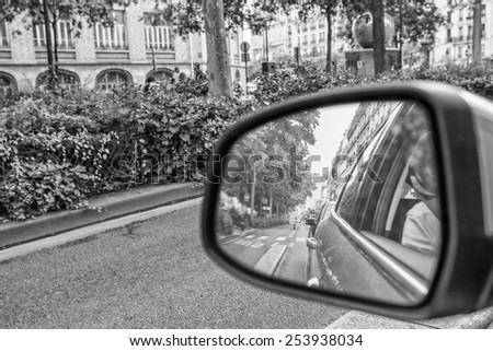 Driving in a big city. Rear mirror view.