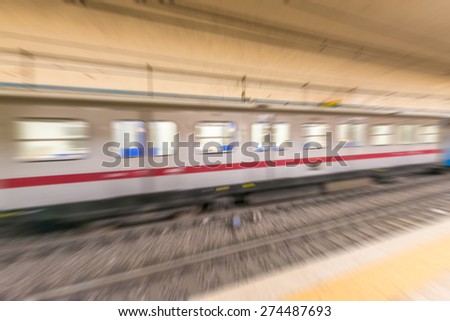 Blurred picture of Rome metro moving train.