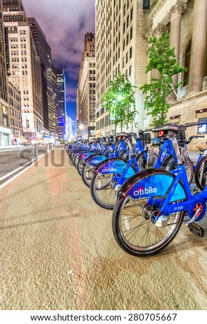 NEW YORK CITY - JUNE 8, 2013: New blue CitiBikes lined up in Manhattan downtown. Citi Bike is the largest bike sharing program in the United States