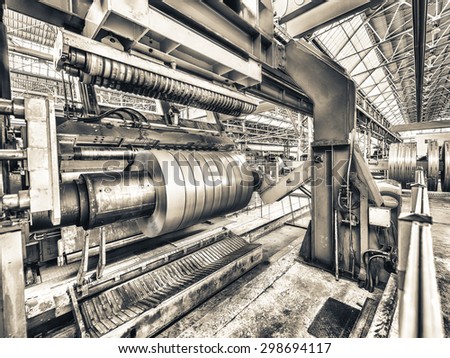 Steel coil cut machine. Industrial environment.