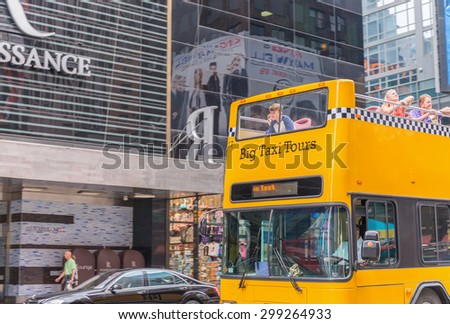 NEW YORK CITY - JUNE 11, 2013: Yellow checkered bus in Manhattan. The bus is a famous tourist attraction.