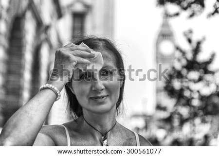 Woman wiping his face with a handkerchief.