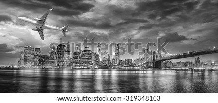 Black and white view of airplane overflying New York City.