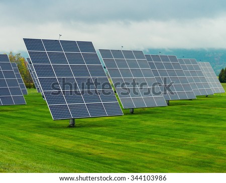 Solar panels placed on a countryside meadow.