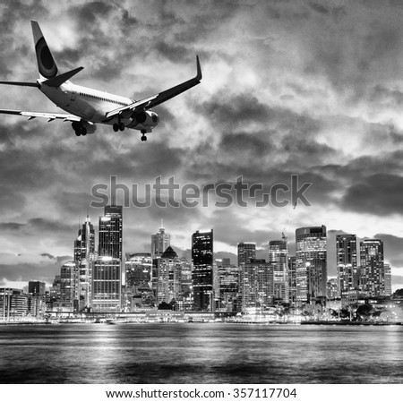 Black and white view of airplane over Sydney. Tourism concept.