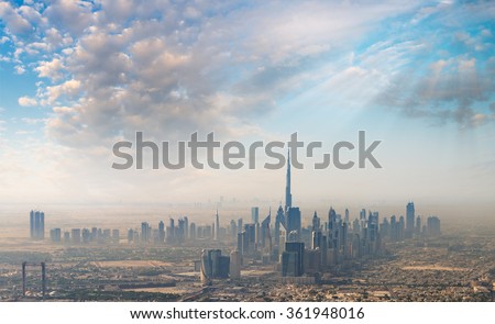 Sunset over Dubai, aerial skyline.