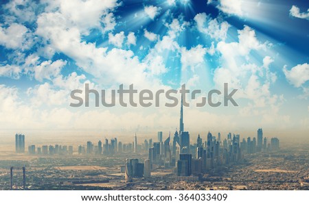 Beautiful skyline of Dubai surrounded by sand dust.