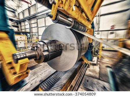 Metal coils machine. Interior of factory. Business concept.