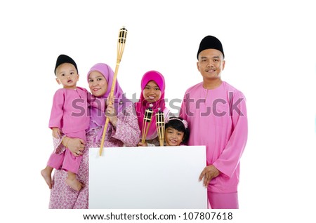 asian malay family during raya with blank cardboard