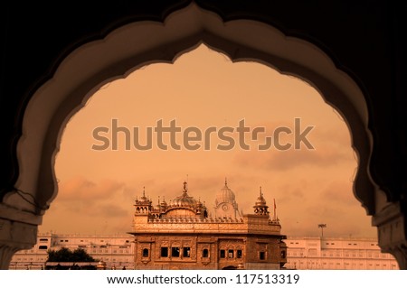 Amritsar Golden Temple  - India. Framed with windows from west side. focus on temple