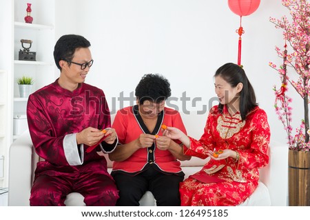 chinese family celebrating lunar new year