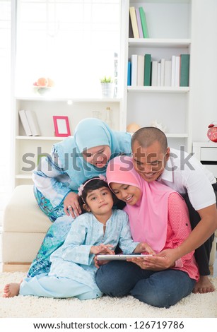indonesian malay family having a good time surfing internet