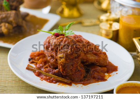 curry chicken cooked in indian style with spicy sauce and chilli