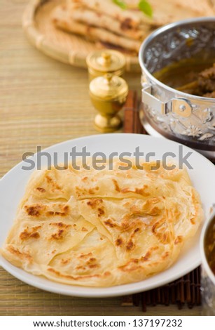 roti canai flat bread, very famous mamak food in malaysia, usually served wtih curry sambal or sugar
