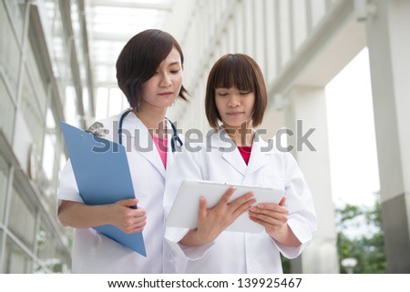 asian chinese female doctors team at the hospital