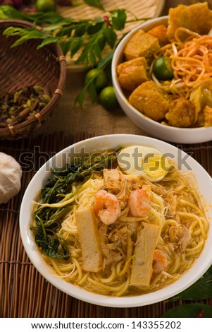singapore famous prawn noodle or har mee with decorations on background