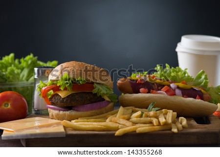 hamburger fast food with plenty of raw materials on the background